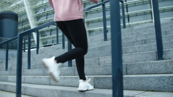Closeup Female Legs Running Up Stairs Outdoor. Close Up Sport Woman Jogging alt
