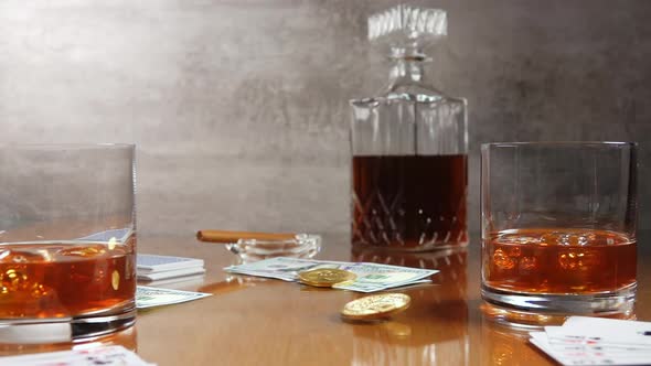 Playing Cards, Money, Two Glasses of Whiskey and Spinning Bitcoin