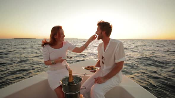 Young Couple on a Sunset Boat Trip