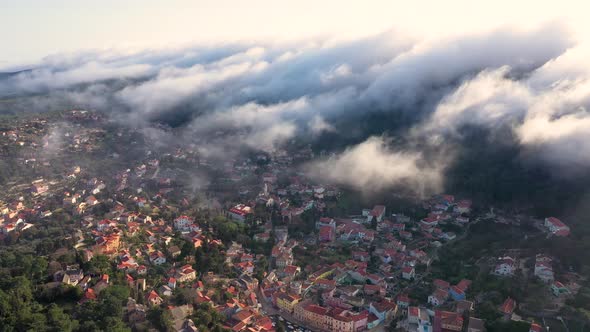 Aerial view above the clouds of Veli Losinj cityscape, Croatia. alt