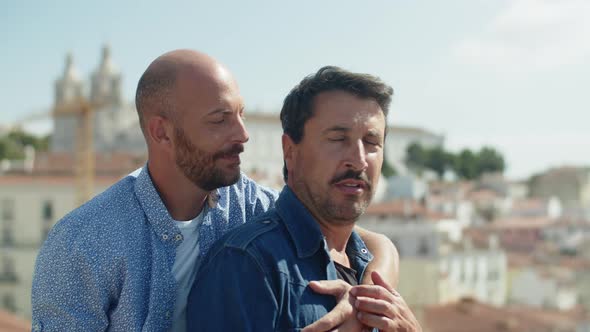 Medium Shot of Handsome Bold Gay Hugging Lover From Back alt