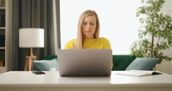 Woman with Laptop at Desk