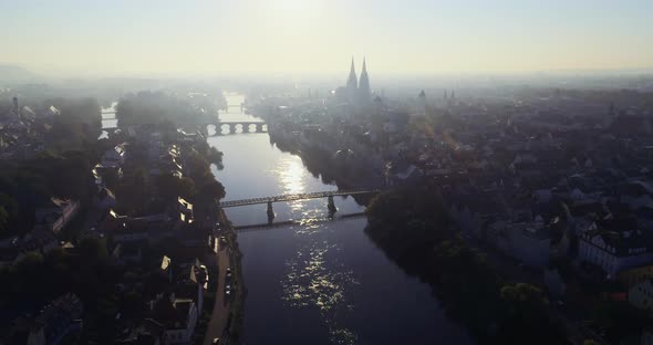Drone shot of Regensburg and the old town in golden October during sunrise alt