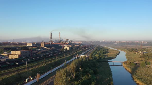 Drone shot of industrial zone with thick smog