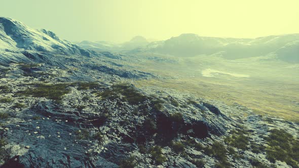 Lanscape with Barren Mountain Which is Covered with Ice alt