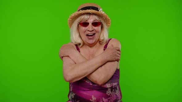 Excited Kindhearted Senior Grandmother Tourist Giving Free Hugs Embrace and Smiling Friendly alt