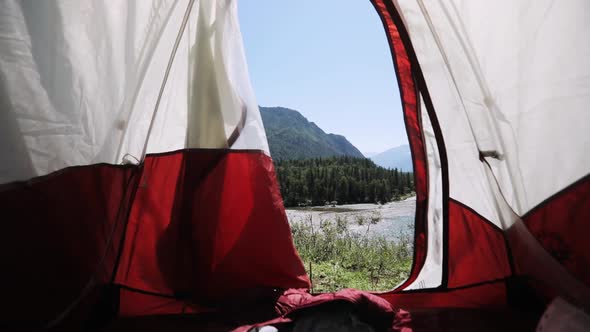 Camera Looks Moves Out From Tent on Mountain Overlooking the River at Summer.