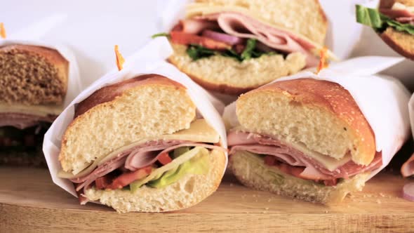 Step by step. Fresh sub sandwich on white and wheat hoagies. alt