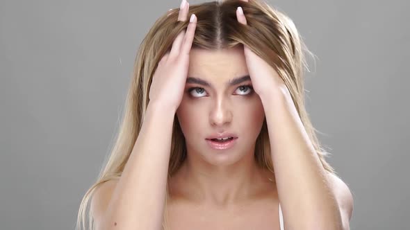 Cute Girl with Horror Touching Hair alt