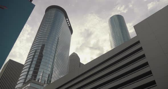 This video is a low angle  establishing shot of skyscrapers in downtown Houston. This video was film alt