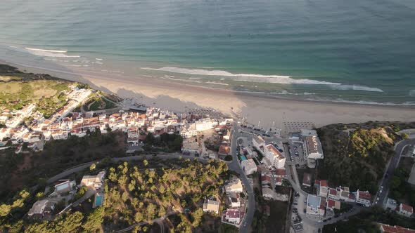 Bird eye view of coastal village Praia da Salema beach in Algarve Portugal. alt