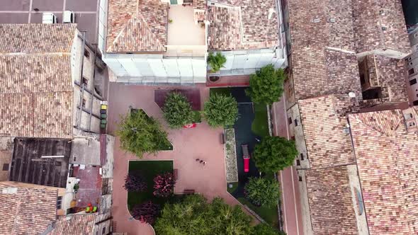 Aerial top down view of a square in a small Italian town alt