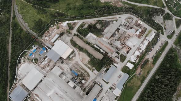 Aerial view of typical russian metallurgy factory. Huge plant with workshops alt