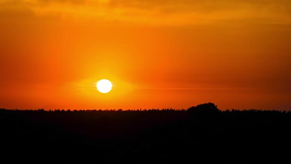Sunset in the Yellow Sky. Timelapse. Big Bright Yellow Sun Moves Down alt