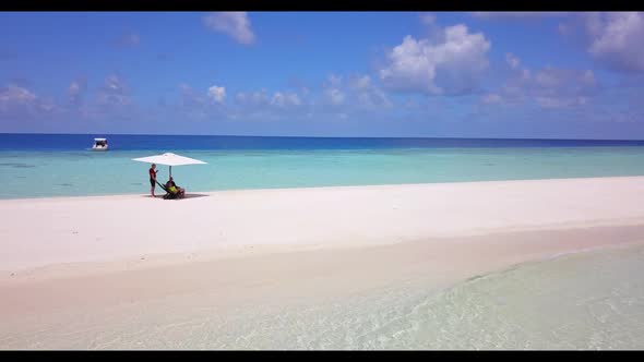 Man and lady sunbathe on marine resort beach time by transparent lagoon and bright sandy background  alt