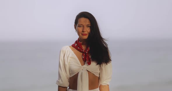 Woman in Elegant Beach Outfit Outdoors Against Sea Background During Summer Vacations alt