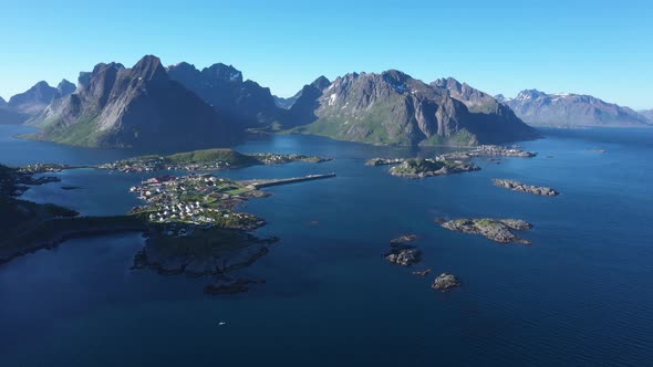 Flight over the sea and view on the fishing village Reine and Hamnoya ,Lofoten Islands,Norway