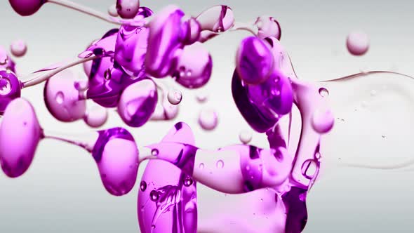 Transparent Cosmetic Purple Oil Bubbles and Shapes on White Background