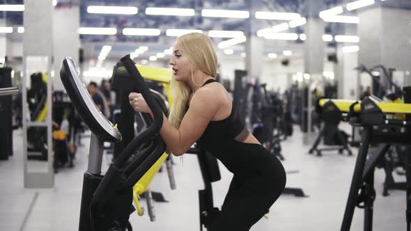 Young Attractive Blond Woman Breathing Intensly While Pedaling on ...