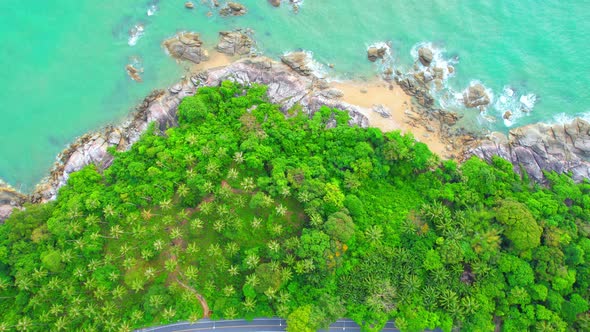 Aerial Top views over beaches, ocean waves crashing on rocks and sand alt