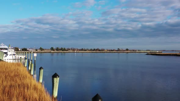 A low angle shot on the boardwalk, facing the railings & pylons. It was taken during a gorgeous day. alt