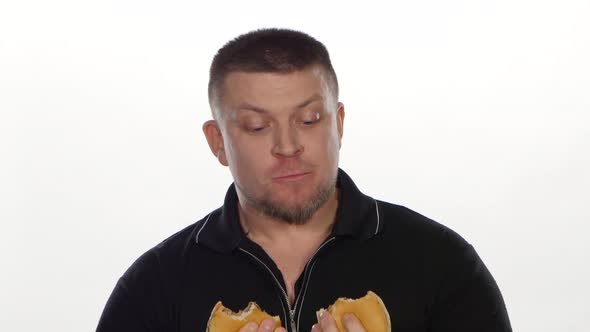 Man Eats a Cheeseburgers. White alt