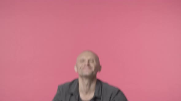 Middleaged Cheerful Handsome Man with Grey Beard and Bald Jumping From Bottom with Thumbsup alt