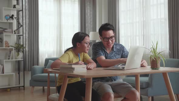 Caring Father Help Daughter With School Subject. Kid Girl Use Laptop Makes Notes alt