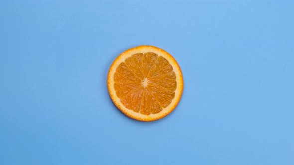 Rotate Half Orange Isolated on Blue Background