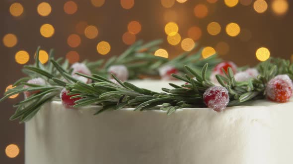 Closeup Panorama of Delicious Christmas White Cream Cake with Rosemary Wreath alt