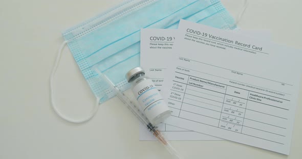 Medical Mask and COVID19 Vaccine on Vaccination Record Card Approved By CDC with Corona Virus alt