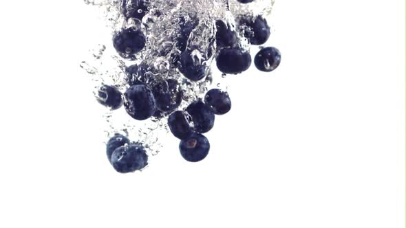 The Super Slow Motion of Blueberries Falls Under the Water with Air Bubbles alt