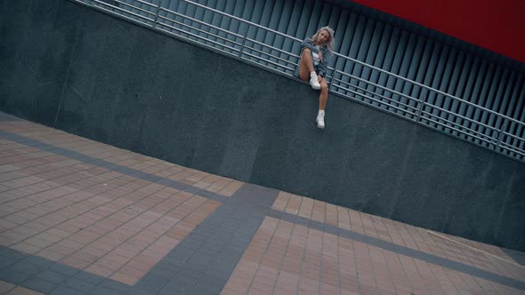 Sitting Woman City Background Posing for Photo in Downtown Street Empty alt
