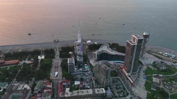 Aerial shot at sunset of modern buildings in downtown of Batumi. Georgia 2022 summer alt