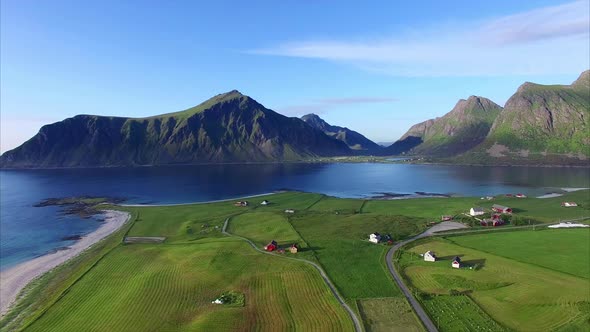 Flying over green countryside on Lofoten islands