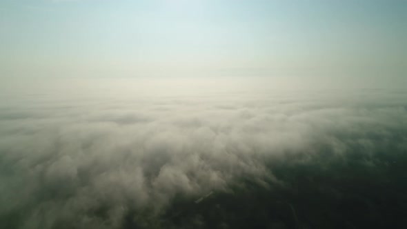 Flight Over the Fog Which Turns Into Clouds