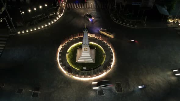 Time lapse of aerial night view of Tugu Jogja or Yogyakarta Monument, Indonesia. alt