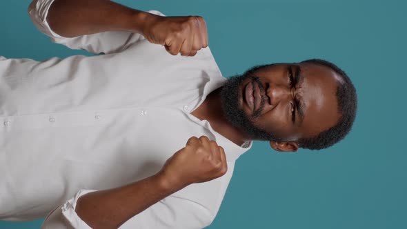 Vertical Video Frustrated Person Clenching Fists and Making Fight Threat alt