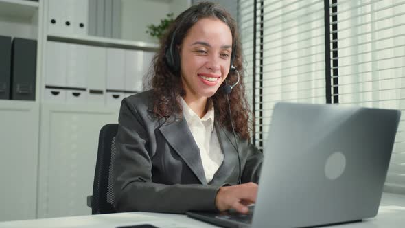 Latino beautiful business woman call center smile while work in office. alt