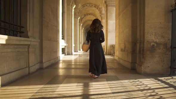 Slow Motion of Pretty Woman in Black Dress Walking Along Paris Streets in France