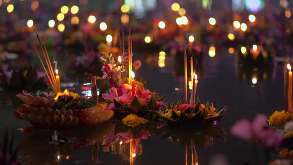Lots of Krathongs Floating on the Water. Celebrating a Traditional Thai Holiday - Loy Krathong alt