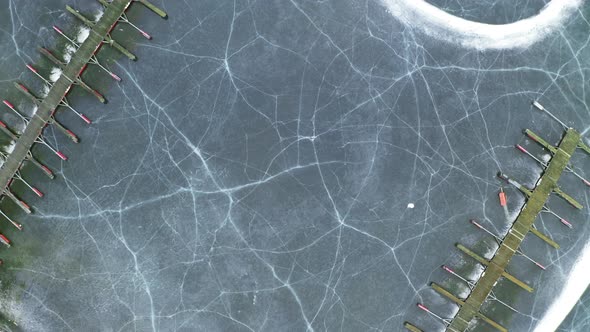 Cracked Ice At Frozen Lake Of Steinsfjorden With Wooden Jetty Of Vik Bathavn At Winter In Norway. - alt