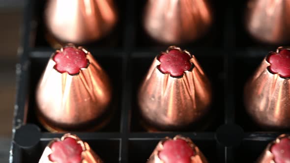 shiny new 9mm hollow point bullets for war, well lit slow macro slide alt