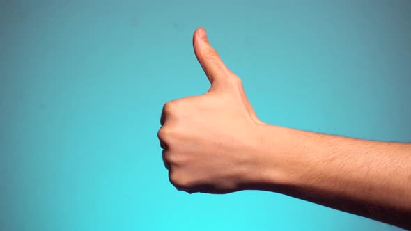 Thumbs Up Gesture GOOD at Blue Background