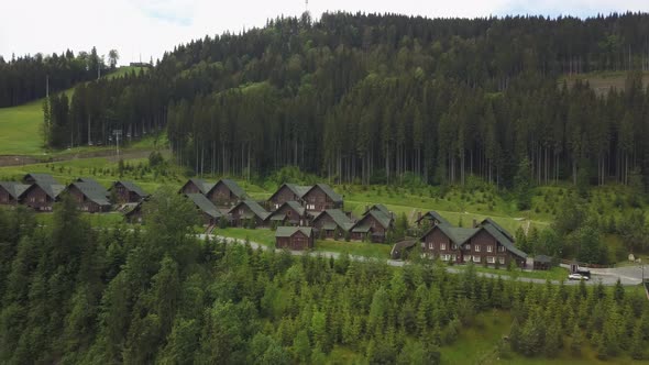 Wooden cottages in the ski resort Bukovel, Ukraine. Summer holidays in the Carpathian mountains