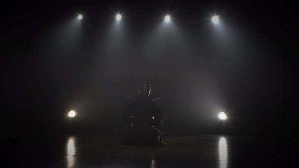 Masculine Kendo Warrior Practicing Martial Art with the Shinai Sword. alt