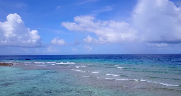 Luxury above abstract shot of a summer white paradise sand beach and blue water background in hi res alt