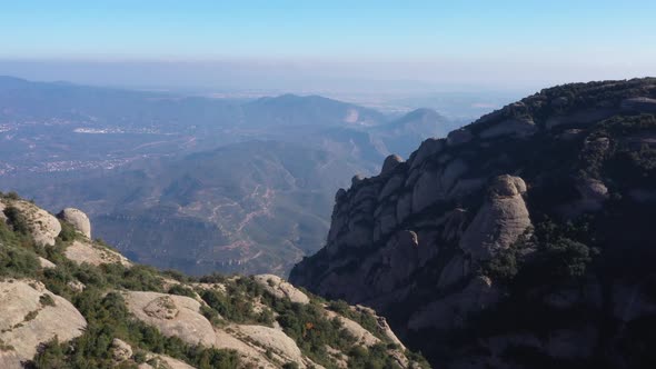 Aerial footage of mountains in Montserrat, Spain