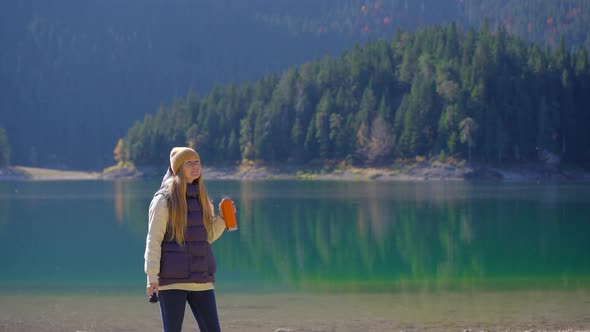 A Young Woman Visits the Crno Jezero or the Black Lake Near the City of Zabljak alt