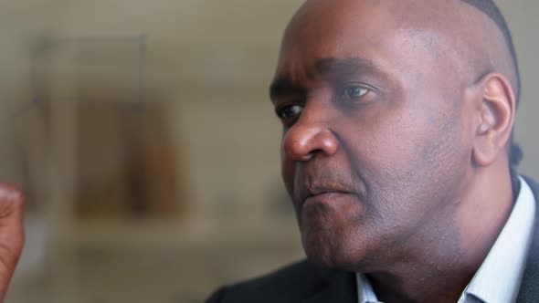 Portrait of Focused African Mature Man Afro Black Ethnic Senior Male Face Specialist Writes with alt